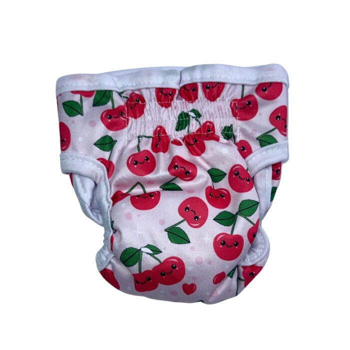 Vista trasera del pañal reutilizable para perra modelo Cerezas, con estampado de cerezas sonrientes y hojas verdes sobre fondo rosa