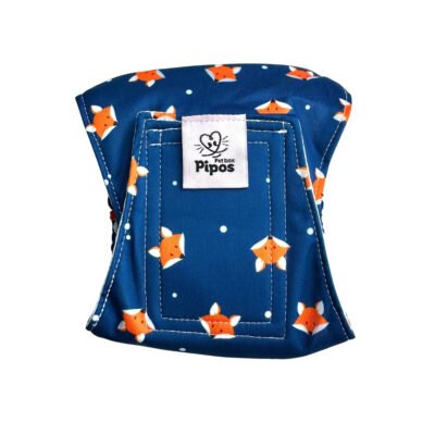 Vista frontal del pañal reutilizable para perro macho modelo Zorritos Mágicos, tipo fajín con estampado de zorritos naranjas sobre fondo azul
